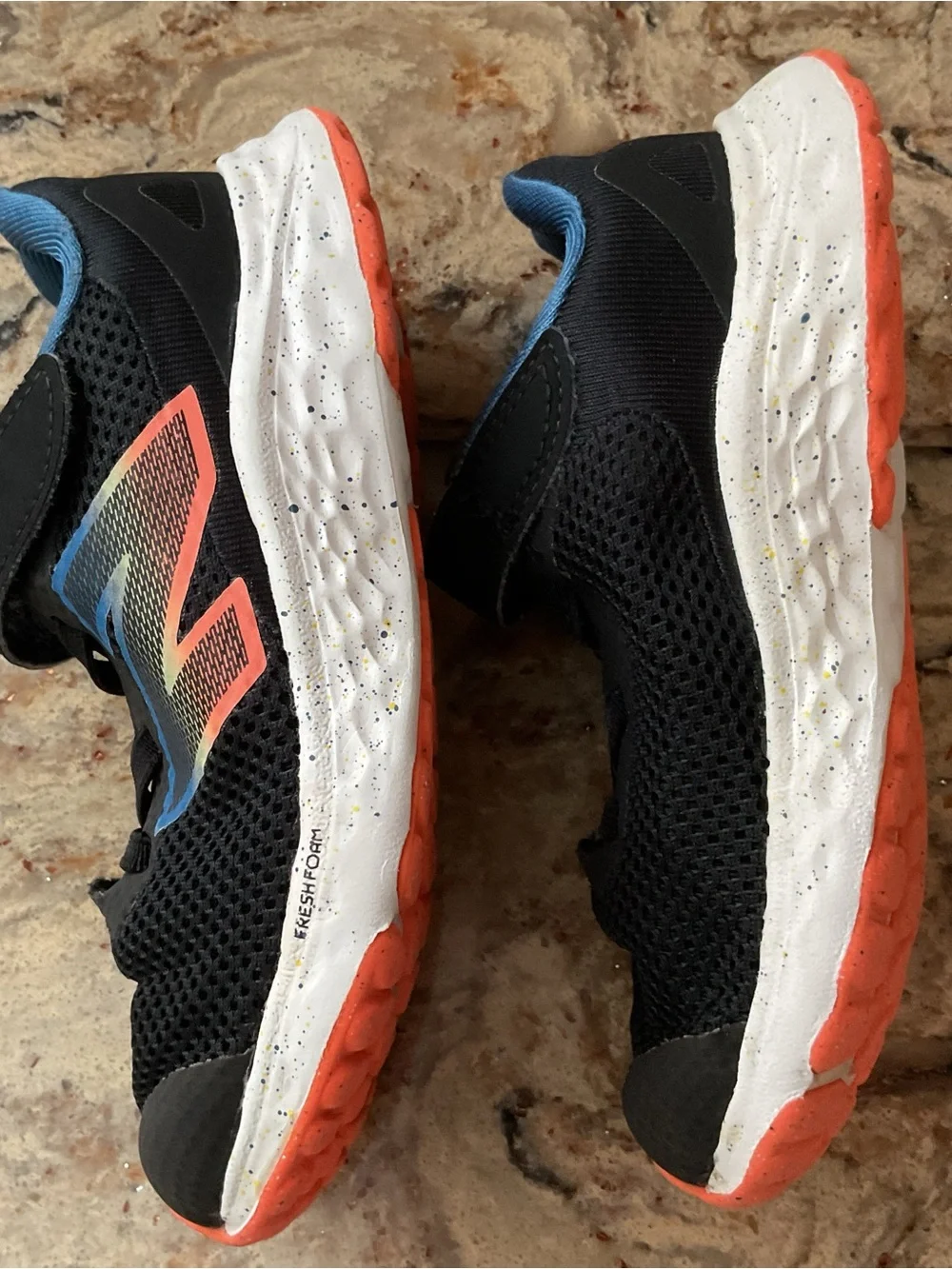 New Balance Kids Black Sneakers with Blue Lining and Coral Accent